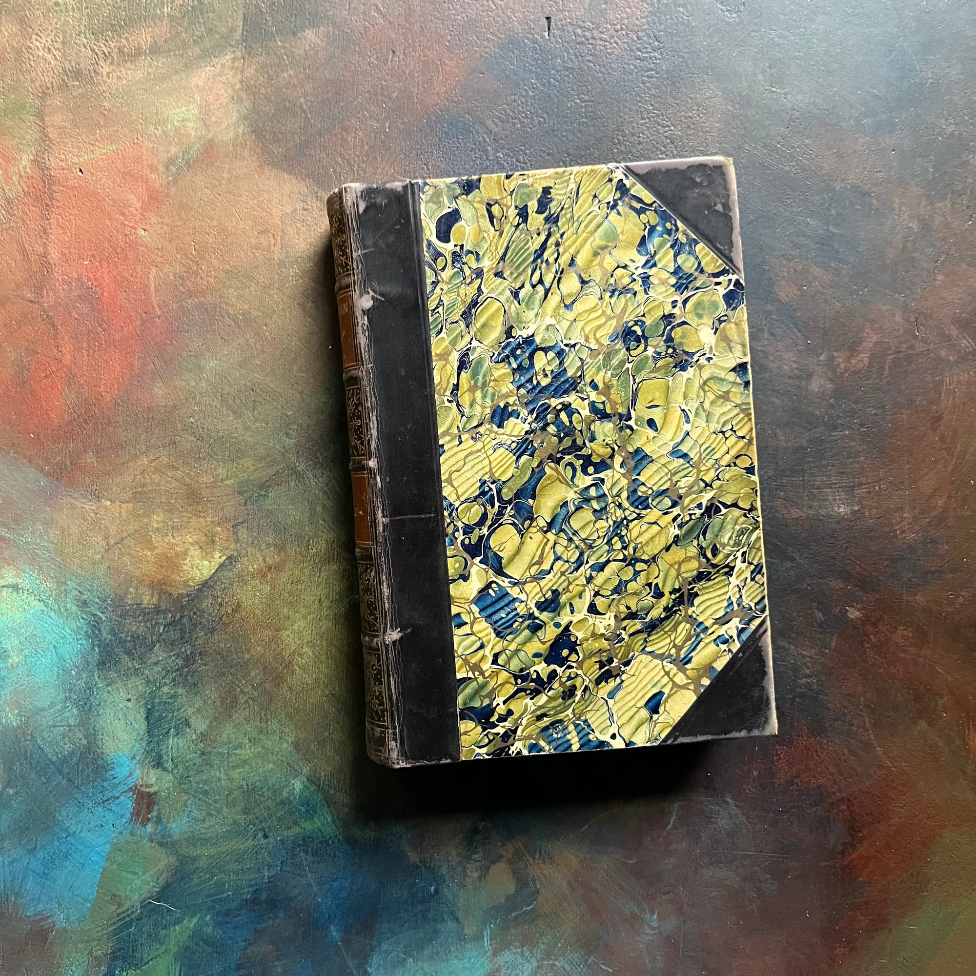 The Prairie written by James Fenimore Cooper-book one of the leather stocking tales-antique leather-bound book with marbled cover-vintage adventure book-view of the front cover