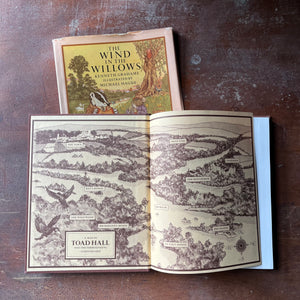 vintage children's chapter book, classic literature - The Wind in The Willows written by Kenneth Grahame with illustrations by Michel Hague - view of the inside cover illustration - a map of Toad hall