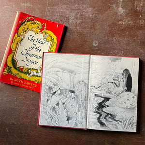vintage children's chapter book - The Year of the Christmas Dragon by Ruth Sawyer with illustrations by Hugh Troy - view of the inside cover with an illustration of a dragon sitting outside of a cave with a little boy offering him vegetation