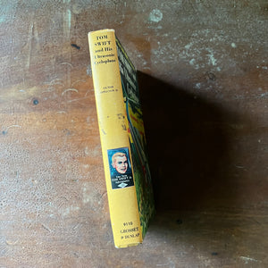 vintage children's chapter book, The New Tom Swift Jr. Adventure Book - Tom Swift and His Ultrasonic Cycloplane written by Victor Appleton II with illustrations by Graham Kaye - view of the spine