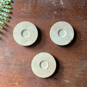 Trio of Small Scotch Plaid Cellulose Tins - view of the bottom of the tins