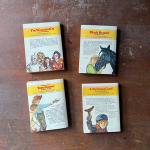 vintage children's chapter books, McDonald's Illustrated Classics - Set of 4 McDonald's Illustrated Classics Books:  The Wizard of Oz, The Adventures of Tom Sawyer, Black Beauty & A Christmas Carol - view of the back covers