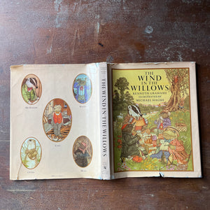 vintage children's chapter book, classic literature - The Wind in The Willows written by Kenneth Grahame with illustrations by Michel Hague - view of the dust jacket's front, spine & back covers