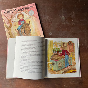 Yonie Wondernose written and illustrated by Marguerite De Angeli-A Caldecott Honor Book-vintage children's picture book-view of the full-color, full-page illustration of Yonie looking inside of a handmade chest