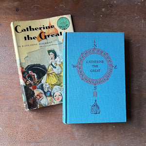 Log Cabin Vintage – vintage children’s book, children’s book, chapter book, living history book, history book, non-fiction, Landmark Series Book – Catherine the Great by Katharine Scherman with illustrations by Pranas Lape - view of the embossed front cover with circular design of a compass & book title depicted