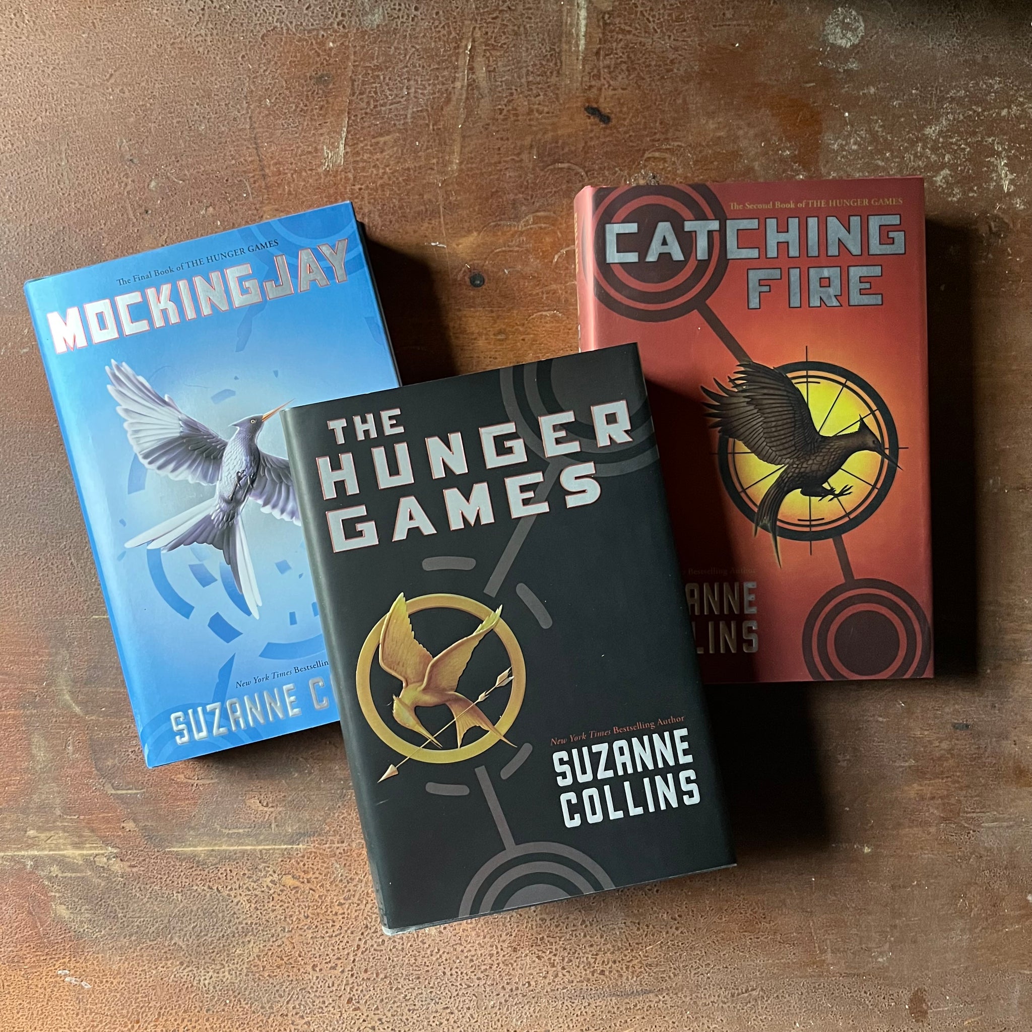 The Hunger Games Trilogy Box Set Written by Suzanne Collins - Log Cabin ...