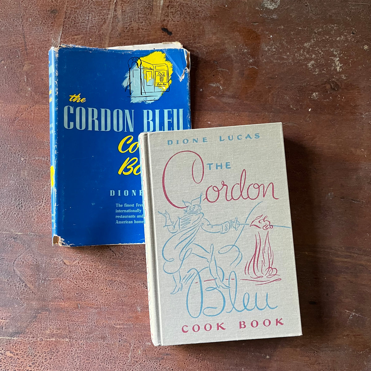 The Cordon Bleu Cook Book by Dione Lucas - front cover & dust jacket shown displayed on a wood table