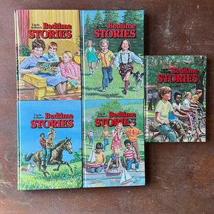 Log Cabin Vintage - vintage children's books, vintage religious books, vintage religious stories, Uncle Arthur - Uncle Arthur's Bedtime Stories Complete Set by Arthur S. Maxwell - view of their colorful front covers featuring children engaging in different outdoor activities & one with a mother reading to her children on a yellow couch