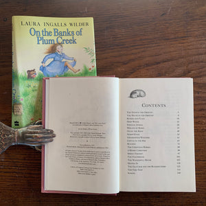 On the Banks of Plum Creek by Laura Ingalls Wilder - a 1981 HarperCollins Publisher Edition with Dust Jacket