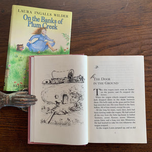On the Banks of Plum Creek by Laura Ingalls Wilder - a 1981 HarperCollins Publisher Edition with Dust Jacket