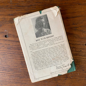 Log Cabin Vintage - vintage fiction, American Author, American novel - A Tree Grows in Brooklyn by Betty Smith - view of the book on a wood table showing the dust jacket's back cover