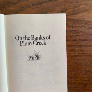 On the Banks of Plum Creek by Laura Ingalls Wilder - a 1981 HarperCollins Publisher Edition with Dust Jacket